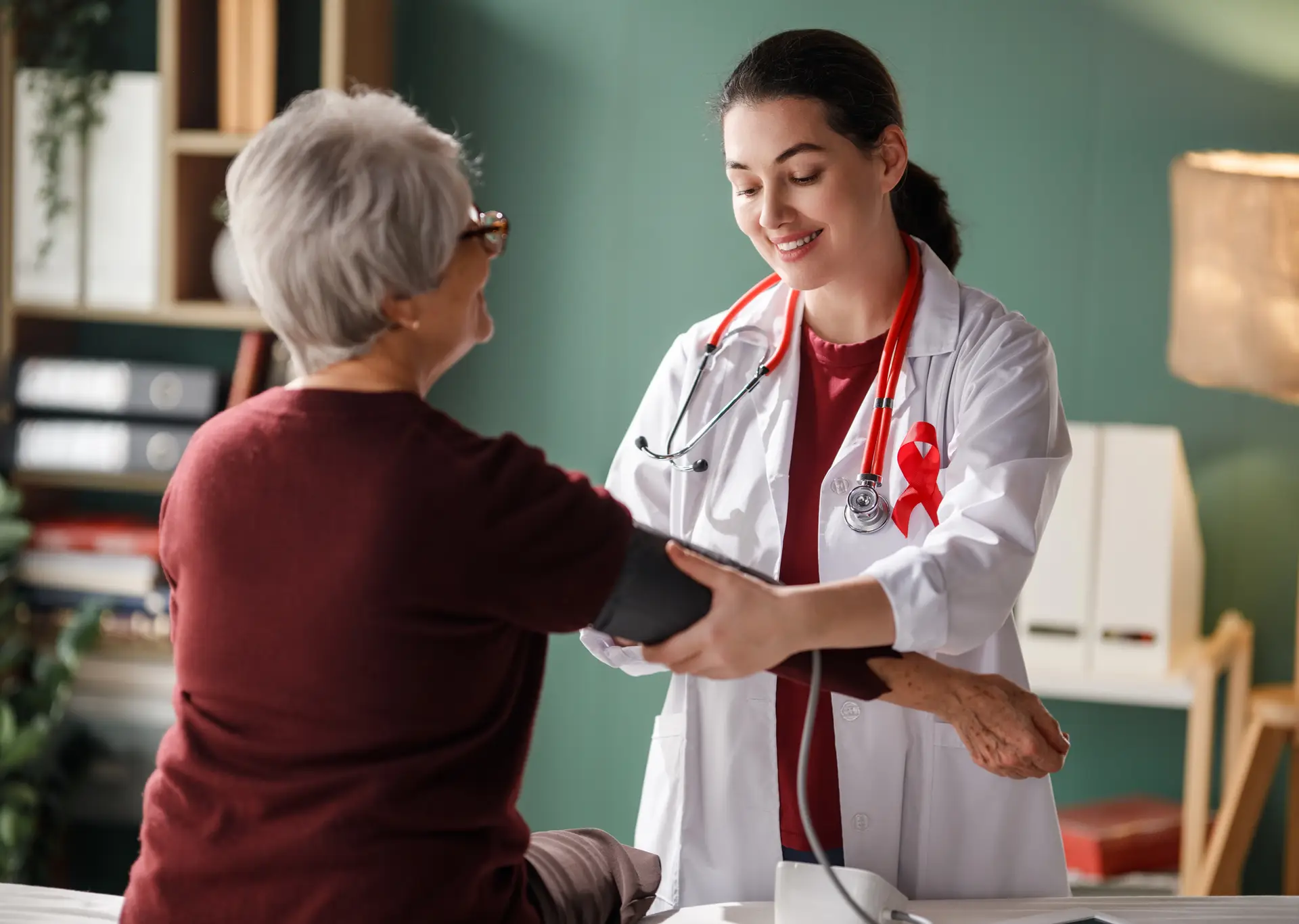 Older woman smiling while talking with her doctor