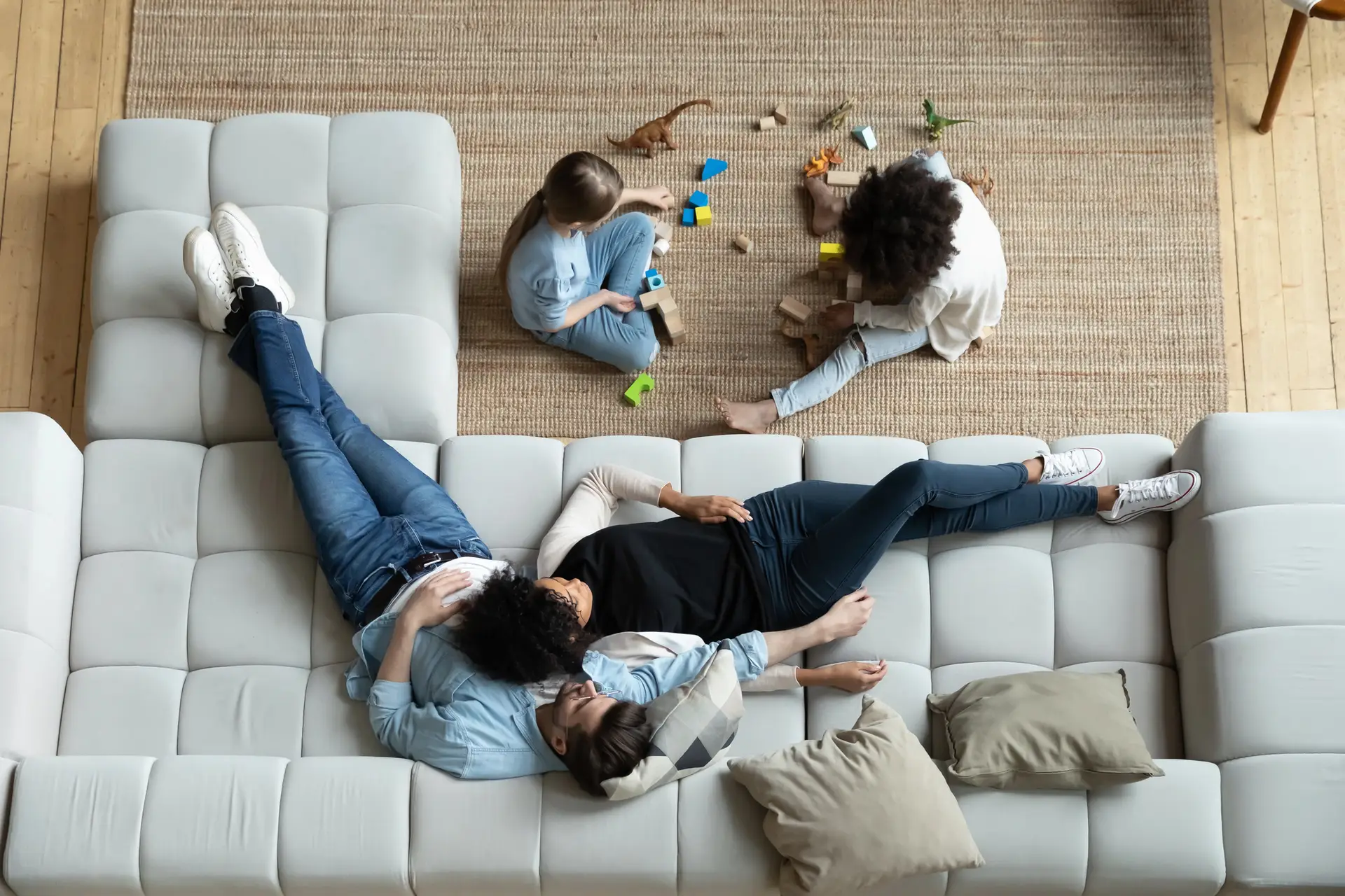 Young family relaxing together in their living room