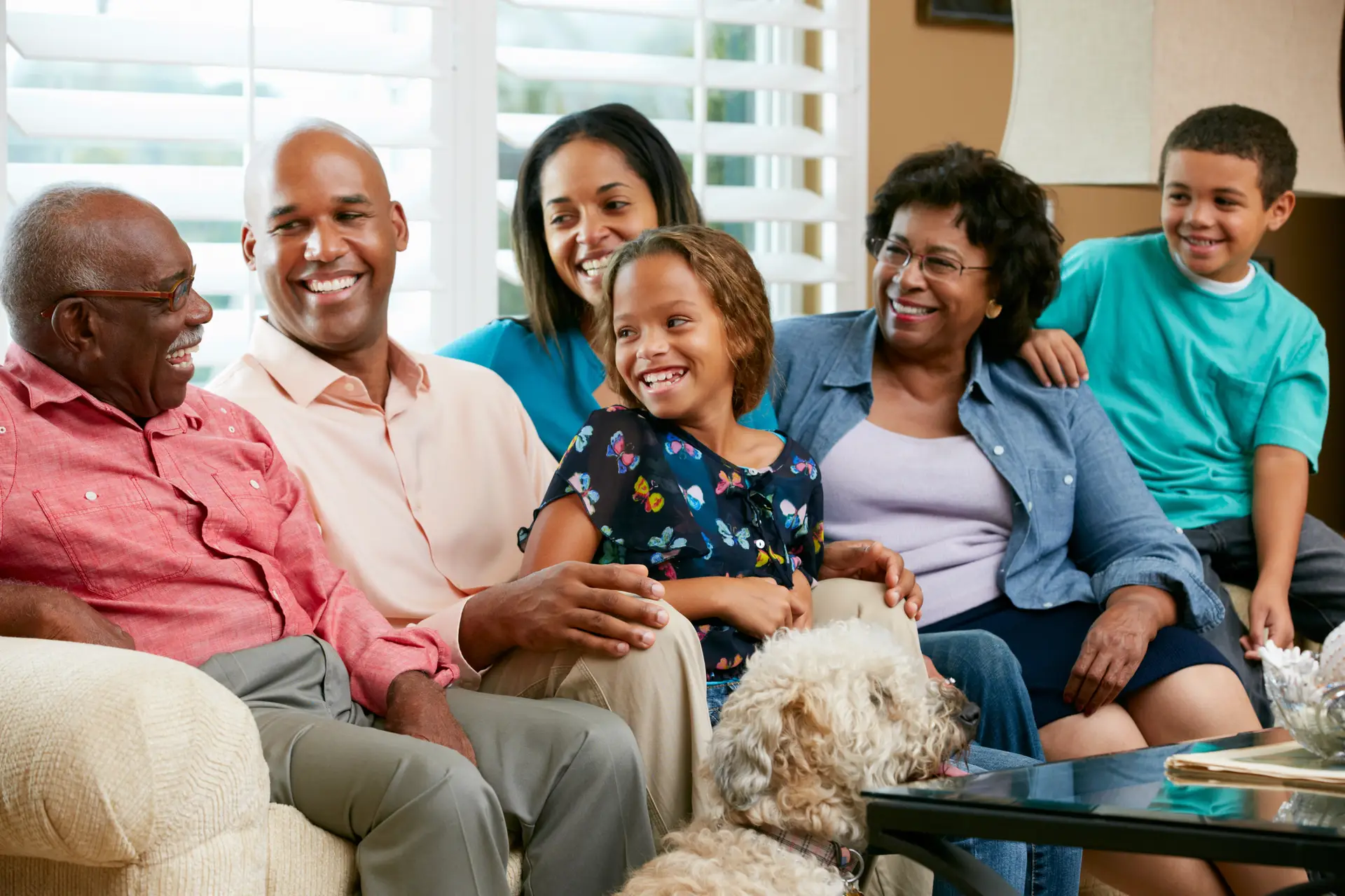 Three generations of a family smiling together